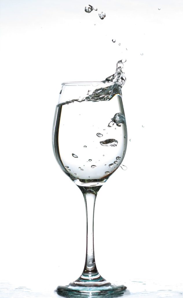 Headache from wine. Wine glass with water